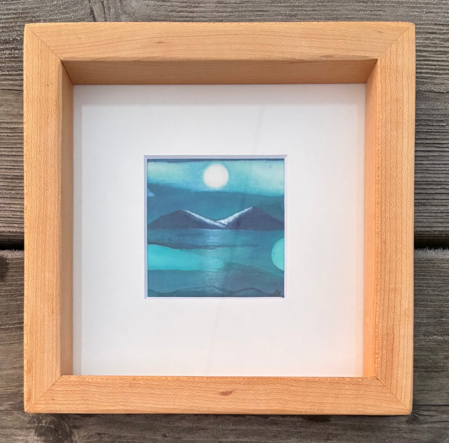 Batik, in a reclaimed maple wood, frame.